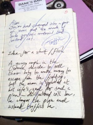 Handwritten notes on a notepad